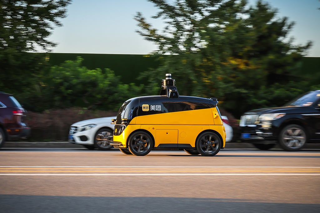 Beijing, China - August 21, 2021: Chinese food delivery giant and ecommerce platform Meituan is testing their autonomous delivery vehicle in Beijing.